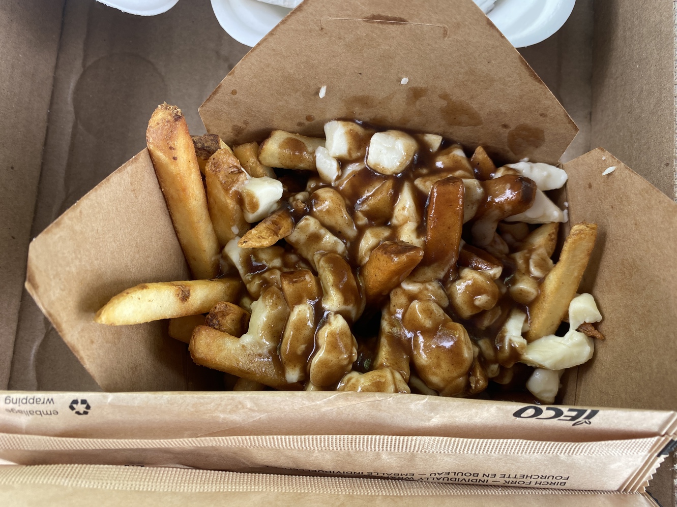 This is the
      poutine dish with French fries, gravy, and cheese curds.